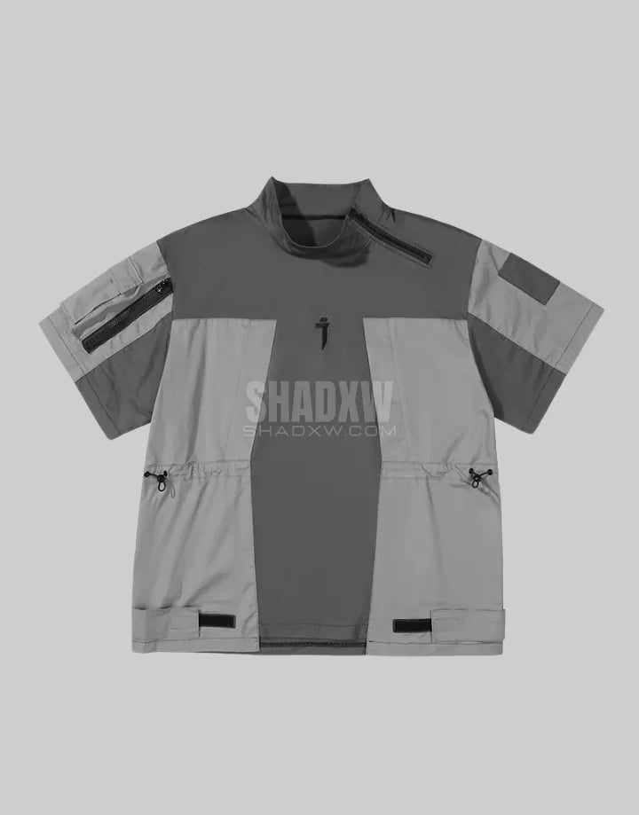 Black and gray techwear t-shirt with geometric color blocking and visual pocket accents creating an elongated avant-garde silhouette — view 2