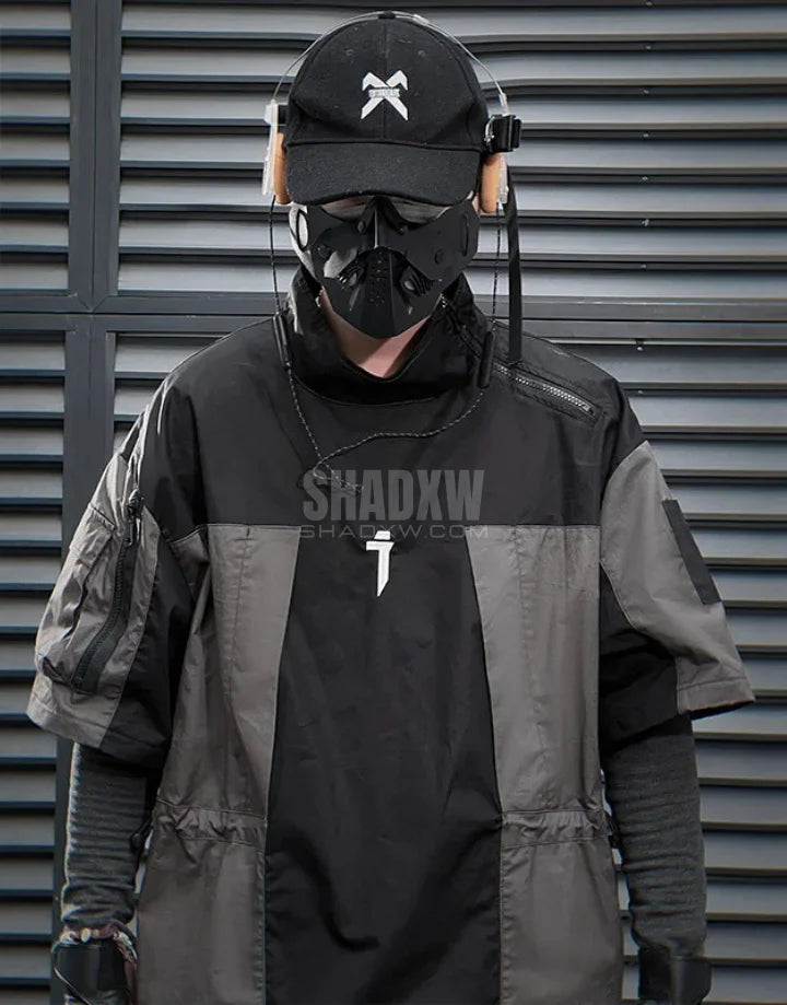 Black and gray techwear t-shirt with geometric color blocking and visual pocket accents creating an elongated avant-garde silhouette — view 4