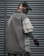 Black and gray techwear t-shirt with geometric color blocking and visual pocket accents creating an elongated avant-garde silhouette — view 6