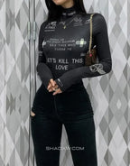 Black long-sleeve fitted bodysuit with multiple gothic-style graphic accents across the torso and sleeves for layered outfits — view 3