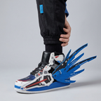 Blue and white winged sneaker worn with black joggers