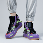 Purple and green sneakers without wings, worn with gray joggers