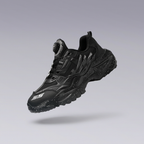 Black Cyber Monster techwear shoe with rotary buckle and chunky speckled sole