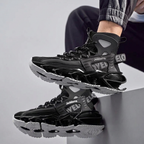 Black AeroFrame sneakers in a seated pose with outsole detail