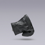 Black leather boot shown in a bent demonstration pose