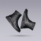 Black leather ankle boots shown from rotated side angles