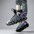 Dark navy and purple sneakers, lifted pair with outsole visible