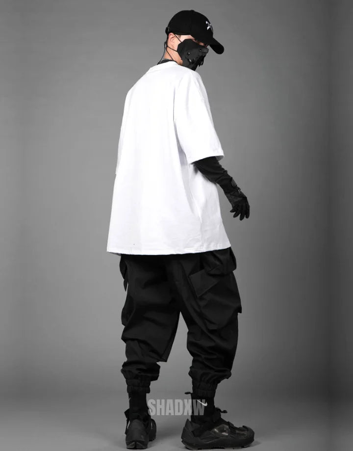Monochrome oversized techwear shirt with minimalist paneling and extended hem in black and white options for contemporary streetwear looks — view 14