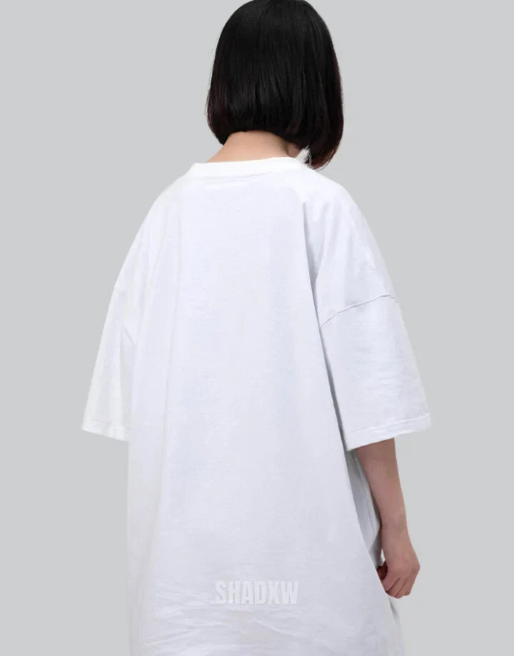 Monochrome oversized techwear shirt with minimalist paneling and extended hem in black and white options for contemporary streetwear looks — view 11