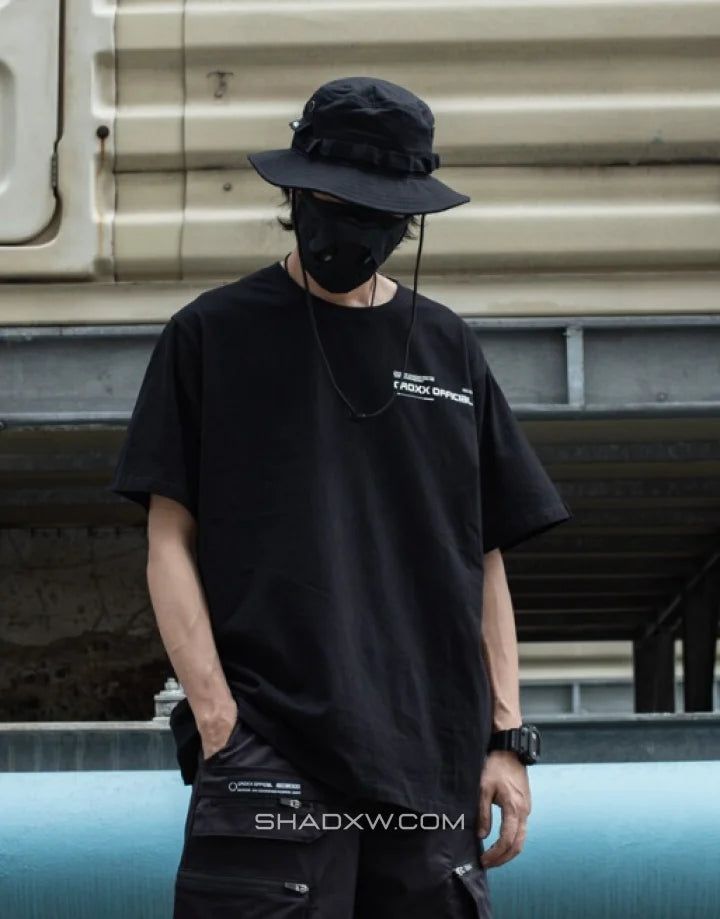 Mechanic-inspired graphic techwear tee with industrial stencil and circuit-style print in a bold utilitarian streetwear presentation — view 4
