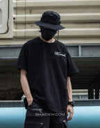 Mechanic-inspired graphic techwear tee with industrial stencil and circuit-style print in a bold utilitarian streetwear presentation — view 4
