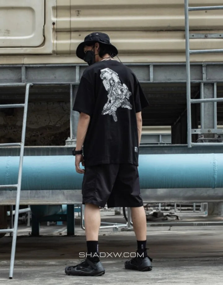 Mechanic-inspired graphic techwear tee with industrial stencil and circuit-style print in a bold utilitarian streetwear presentation — view 5