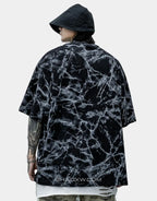 Oversized graphic techwear tee featuring a large moth motif in grunge street goth style available in black and white colorways — view 4