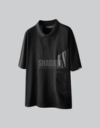 Black short-sleeve multi-pocket tech shirt with modular front panels and adjustable back drawcords in urban minimalist style — view 2