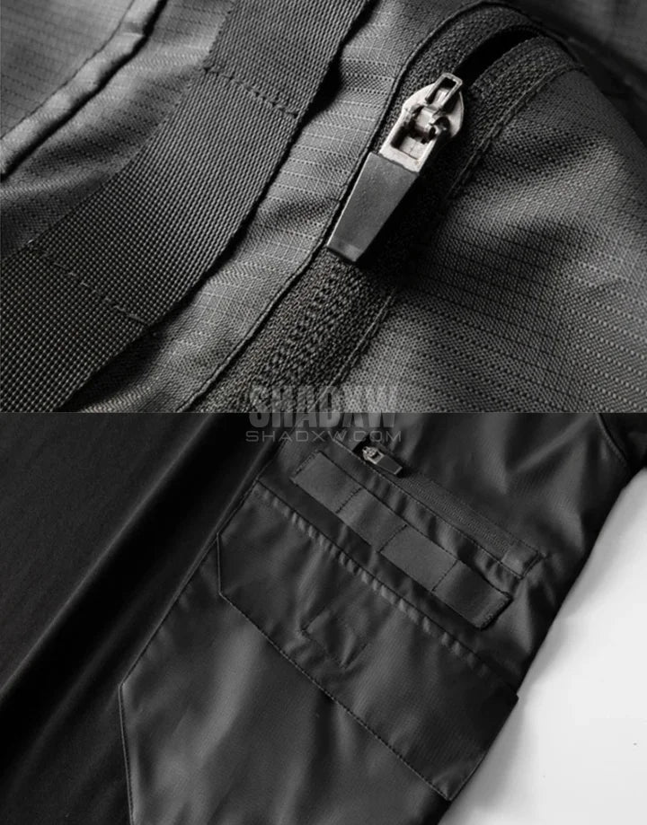 Black short-sleeve multi-pocket tech shirt with modular front panels and adjustable back drawcords in urban minimalist style — view 9