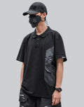 Black short-sleeve multi-pocket tech shirt with modular front panels and adjustable back drawcords in urban minimalist style — view 1