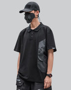 Black short-sleeve multi-pocket tech shirt with modular front panels and adjustable back drawcords in urban minimalist style — view 1