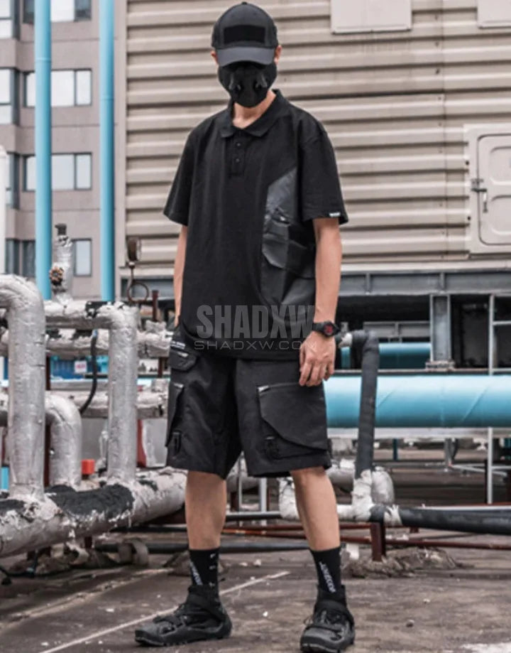 Black short-sleeve multi-pocket tech shirt with modular front panels and adjustable back drawcords in urban minimalist style — view 10