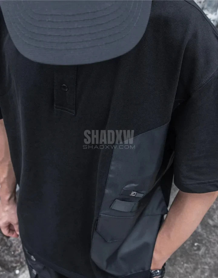 Black short-sleeve multi-pocket tech shirt with modular front panels and adjustable back drawcords in urban minimalist style — view 7