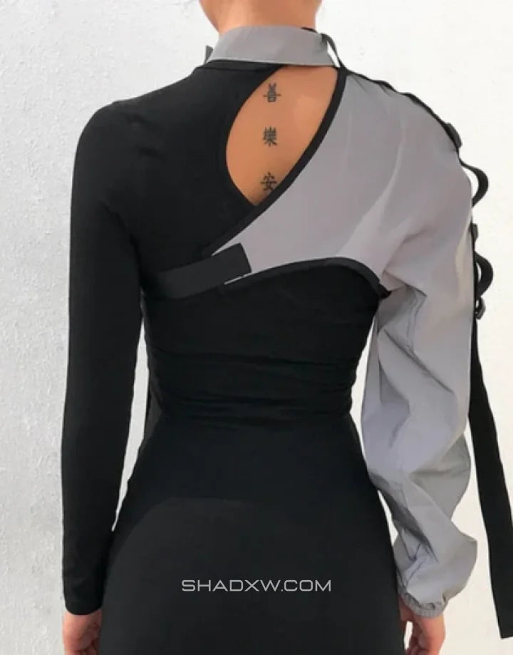 Asymmetric one-shoulder techwear top shown in black and reflective finish options with a sculptural shoulder line and modern urban styling — view 6
