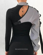 Asymmetric one-shoulder techwear top shown in black and reflective finish options with a sculptural shoulder line and modern urban styling — view 6