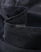 Minimalist oversized black techwear t-shirt with clean seam lines, long hem, and understated urban design for layered outfits — view 5