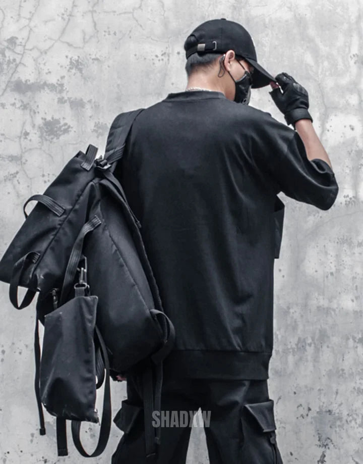 Crew-neck techwear shirt with chest panel accents and layered seam details in a modern urban aesthetic suitable for layering — view 4