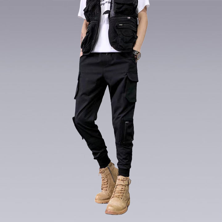 our X-21 Cargo Pants are perfect for rough travel or everyday wear. Made of a durable, flexible fabric for comfort to make your adventures extra memorable. Shown in black with 6 pockets to fit all your necessities plus an intricate design throughout each leg. Can be dressed up or down so you can have one pair of pants that does it all ― keep yourself looking fashionably laidback no matter what adventure awaits you!