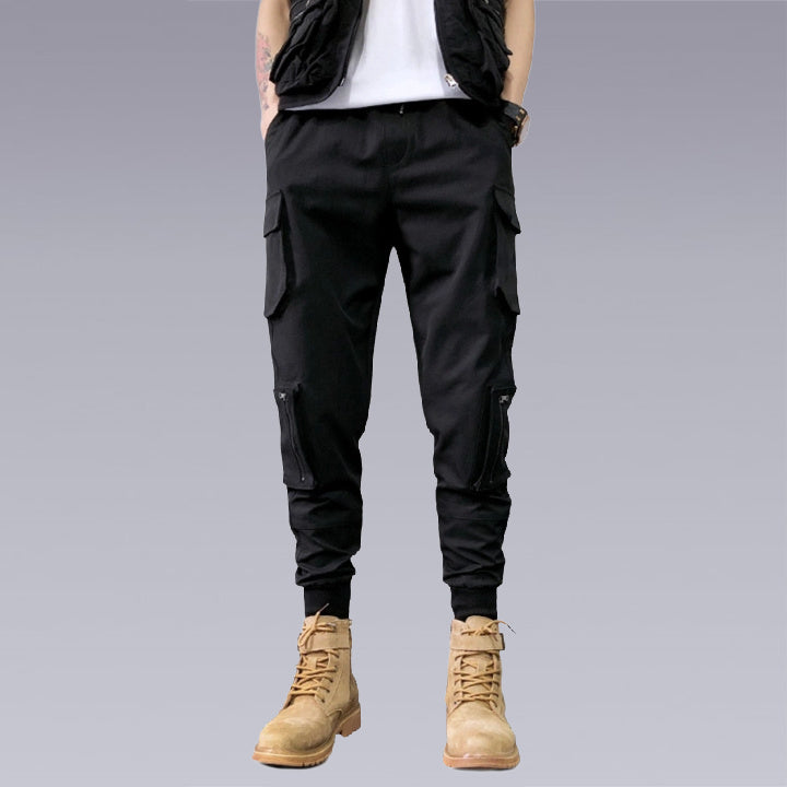 Elvvie -The X-21 Cargo Pants are sturdy and sleek. The slant side pockets create a perfect fit in any setting, whether you are traveling or just lounging leisurely on the beach. With 3D multi-pocket accessories, these pants are made with quality that lasts from dawn to dusk and every moment in between.