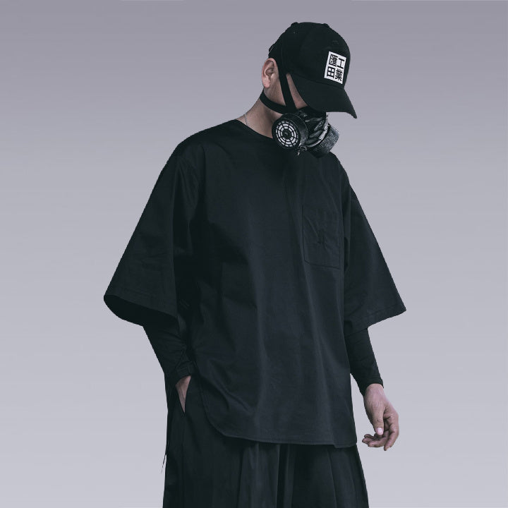 Man wearing THE DARK UNISEX TECHWEAR T-SHIRT