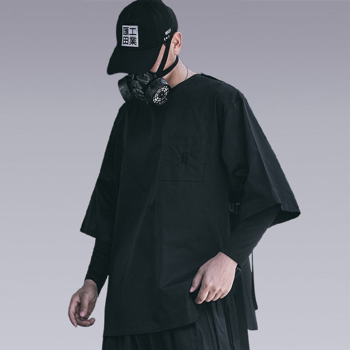 Man wearing THE DARK UNISEX TECHWEAR T-SHIRT