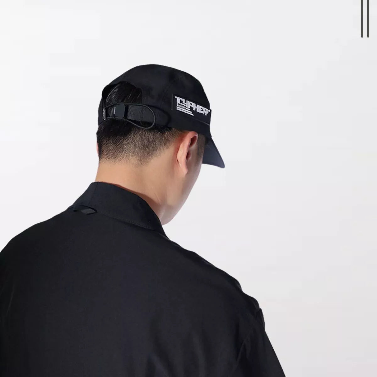 A Man Wearing The Techwear Functional Waterproof Cap By Clotechnow